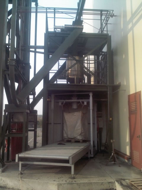 Filling and weighing of big bags with dewatered sludge in a municipal  waste water treatment plant 
